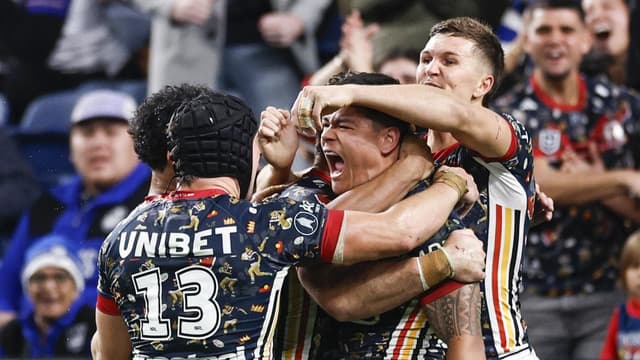 Roosters pip Dogs to go level with Penrith at top
