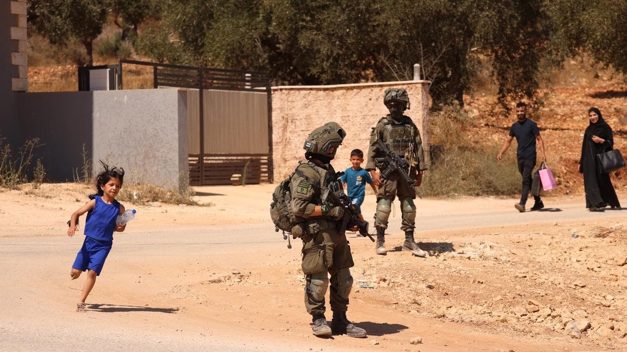 Israel sends troops as settlers besiege West Bank homes