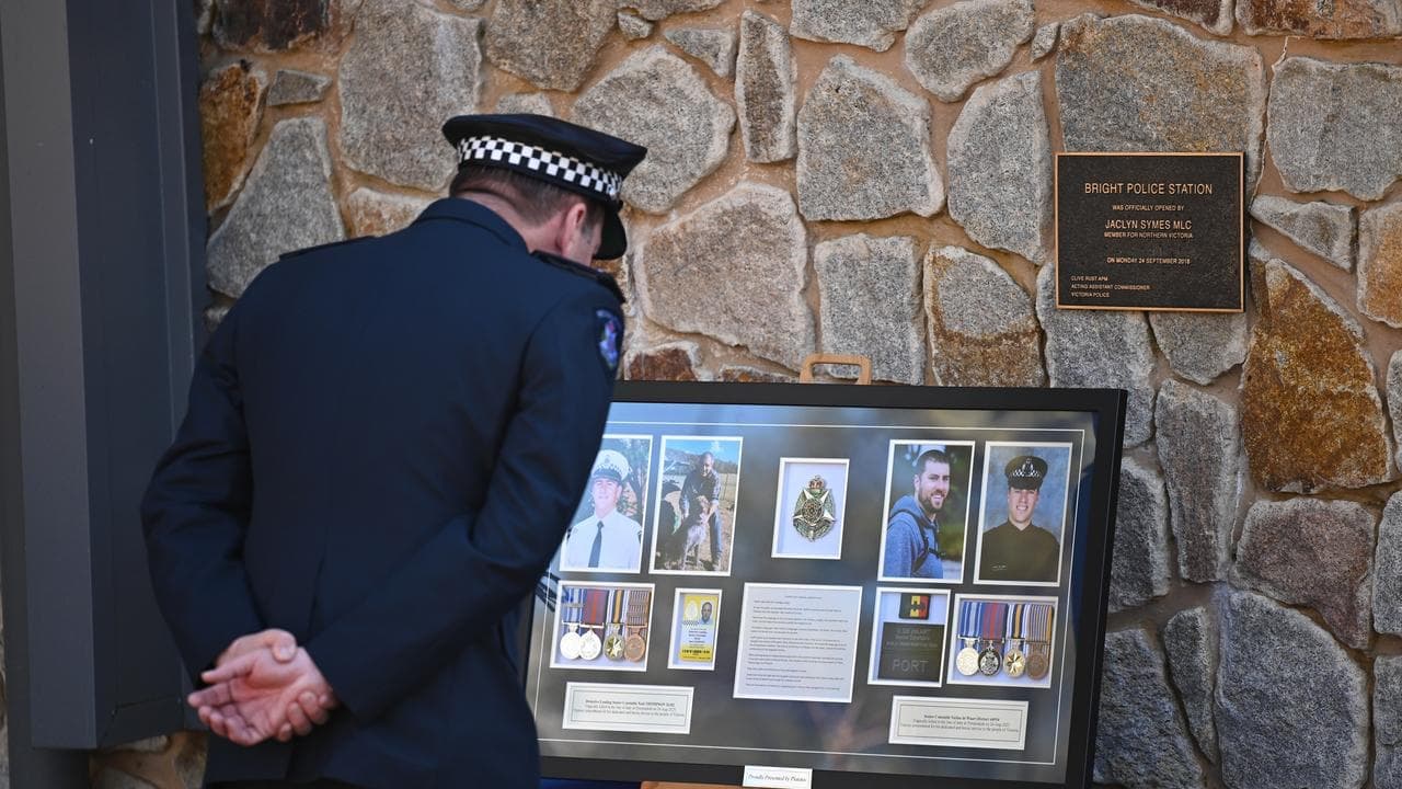 Hundreds stand in respect as slain officers honoured