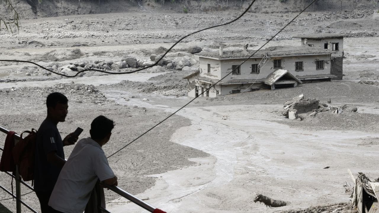 Urgent search for Australians missing in flash floods