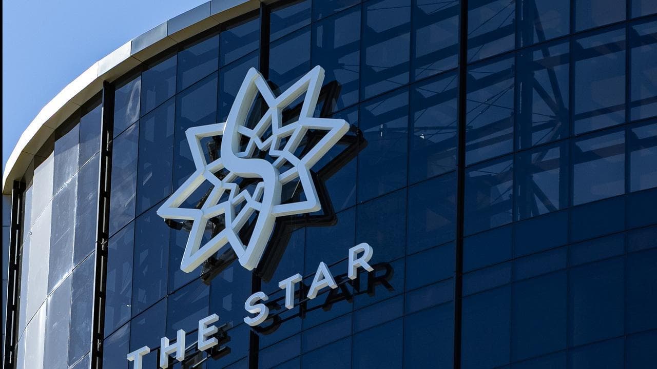 Chips still down at casino group as loss narrows