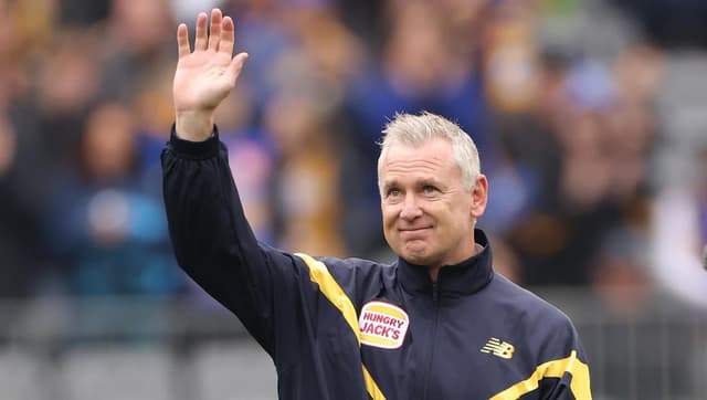 AFL flag coach to 'have a good think' about North job