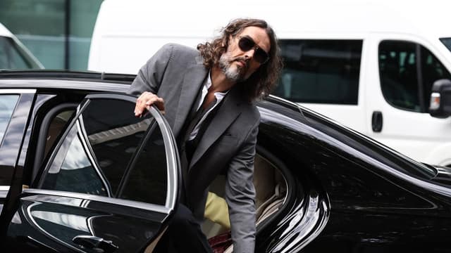 Russell Brand at court for hearing before rape trial