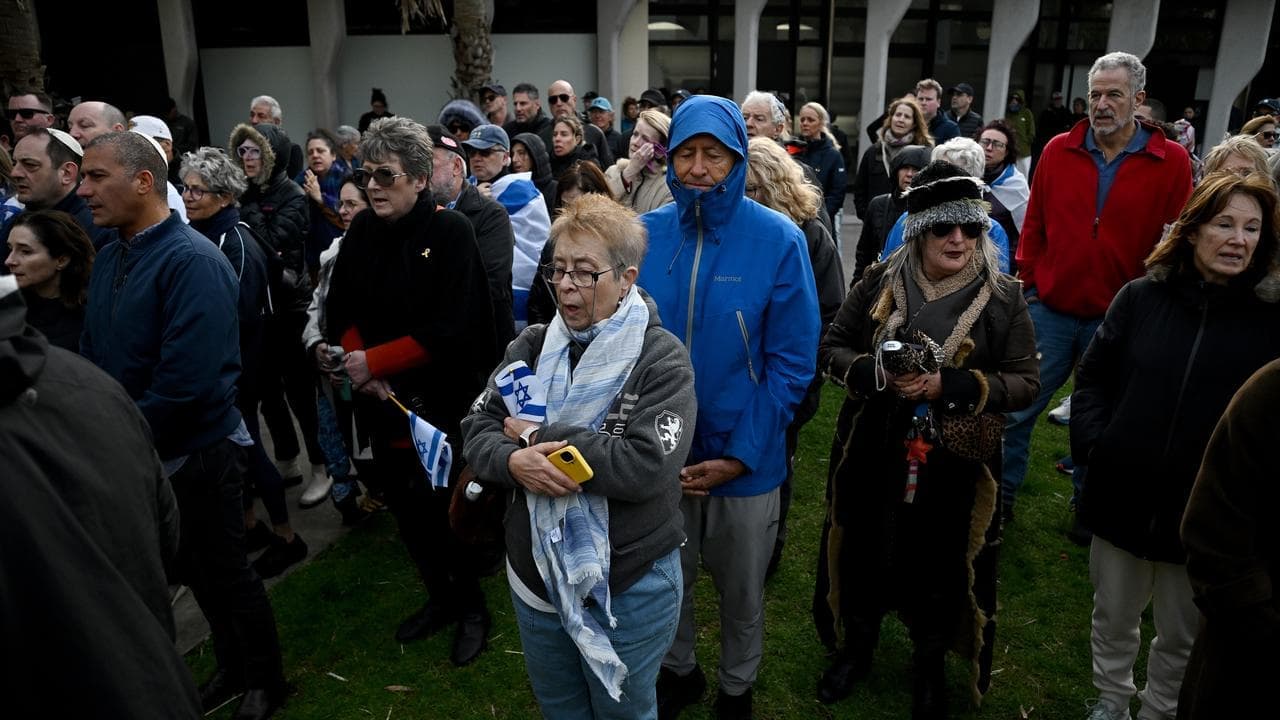 Hundreds gather to mark moment October 7 attack started