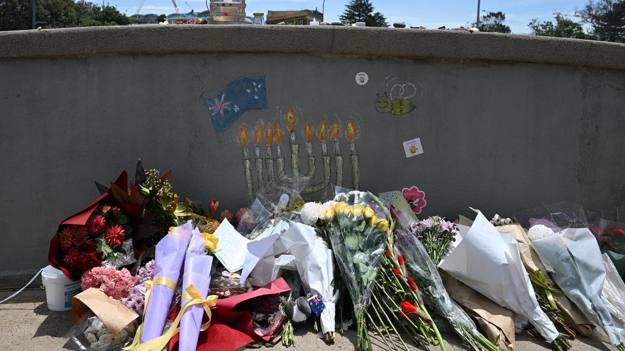 Man charged over 'offensive' act at Bondi attack site