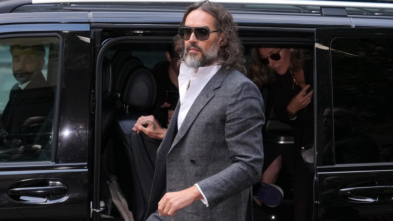 Russell Brand fronts court for rape, sex assault trial