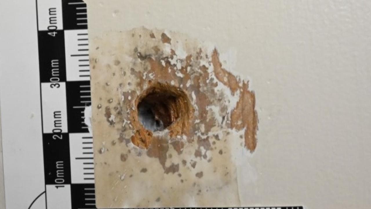 Bedroom door gun marks may hold key to cop murder trial