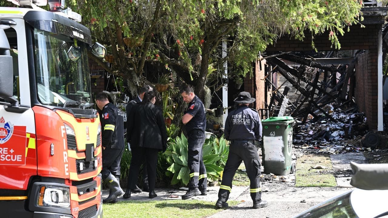 Manhunt after elderly woman rescued from inferno