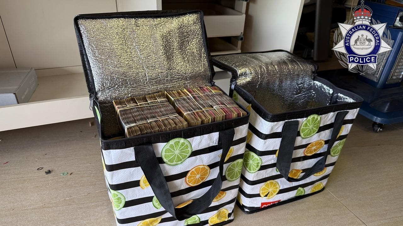Cold hard cash stashed, alleged launderer arrested