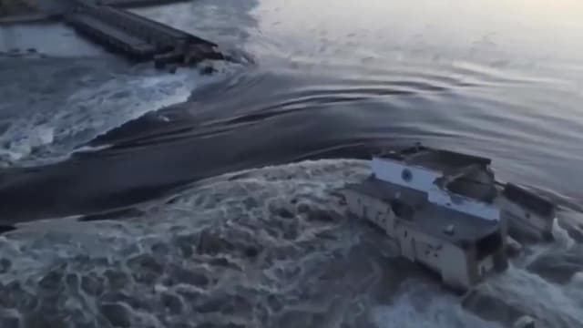 Dam destroyed in Ukraine, flooding war zone