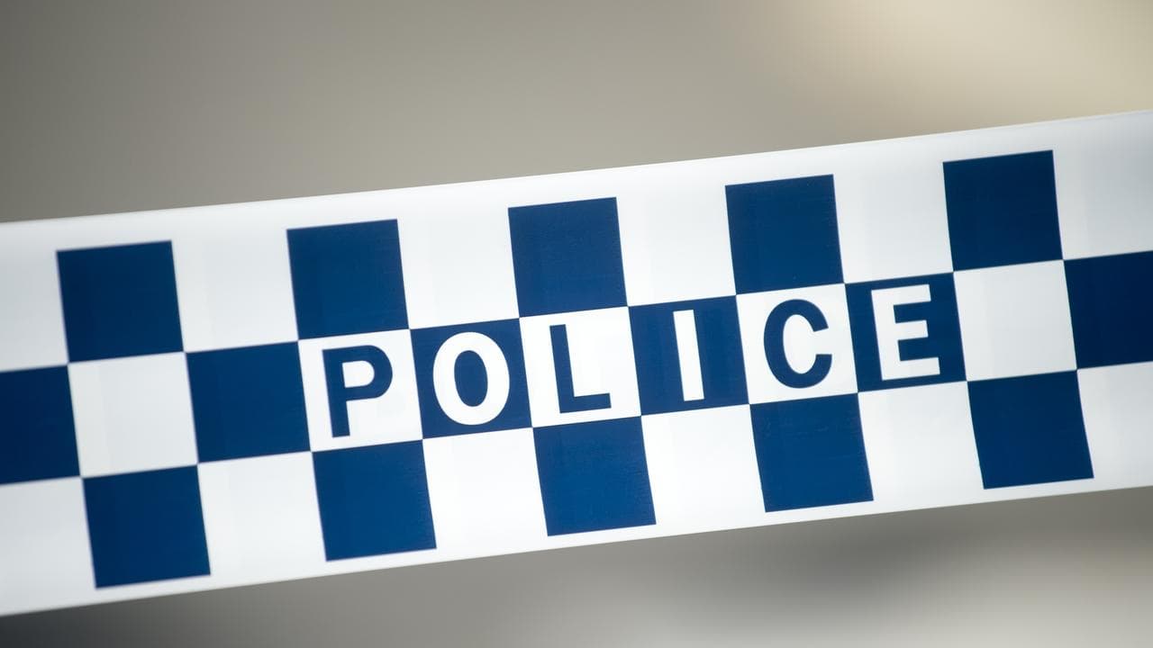 Son charged with murder of man found dead in backyard