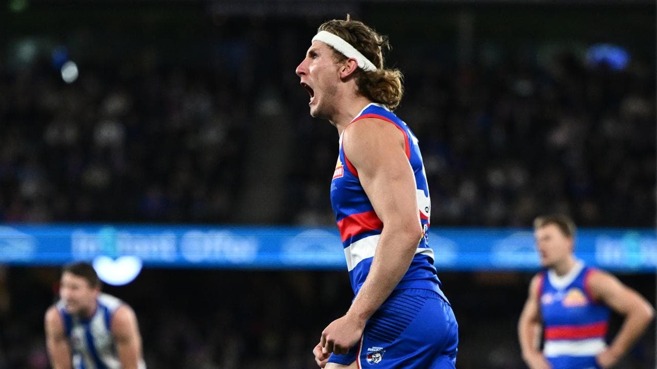 Dogs' star Naughton to stay forward despite injuries