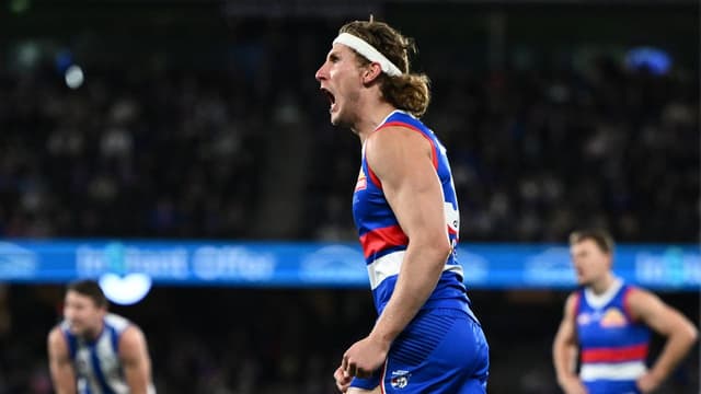 Dogs' star Naughton to stay forward despite injuries
