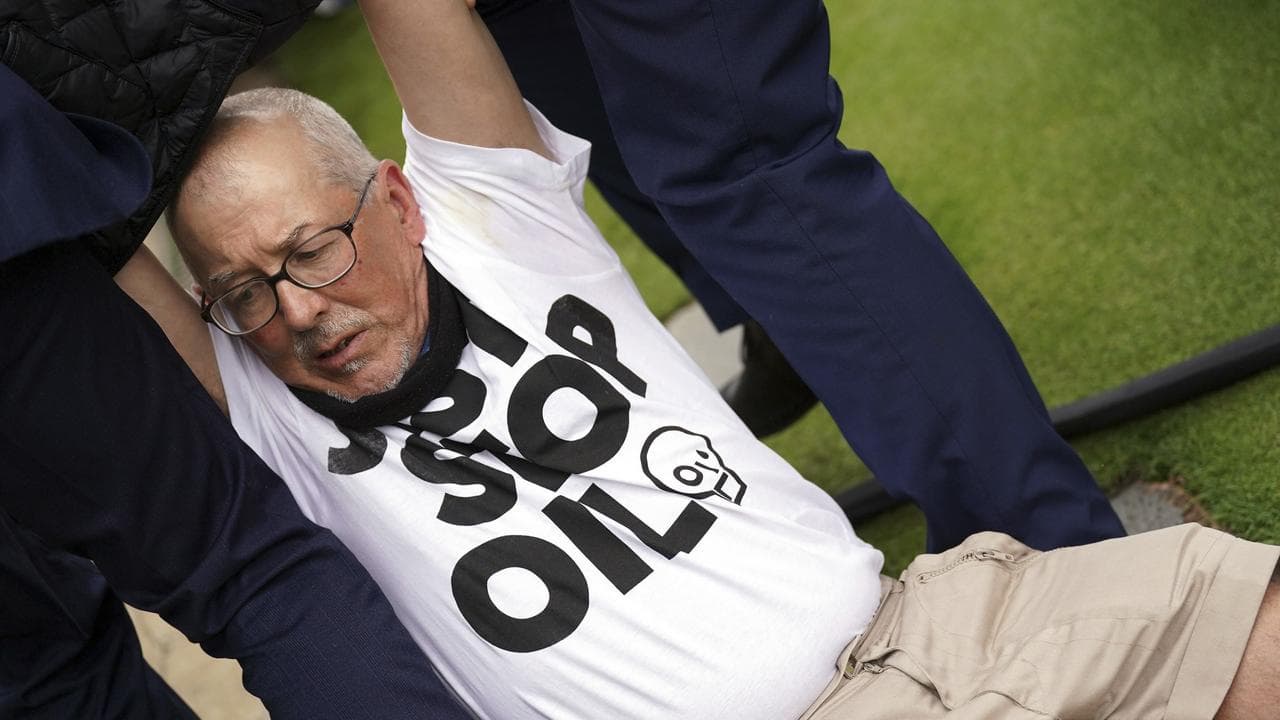 Saville derailed by protester on tough day for Aussies