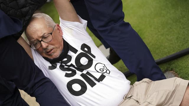 Saville derailed by protester on tough day for Aussies