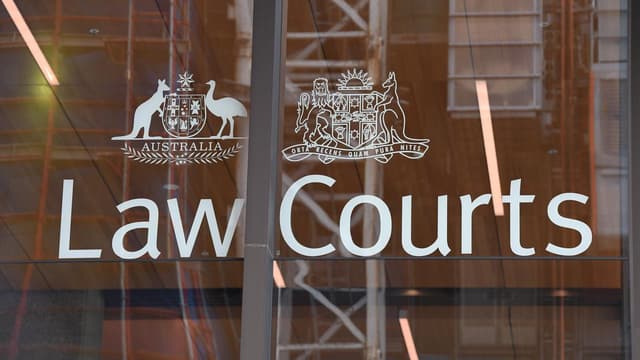 Man bailed on DV charges as woman's death probed