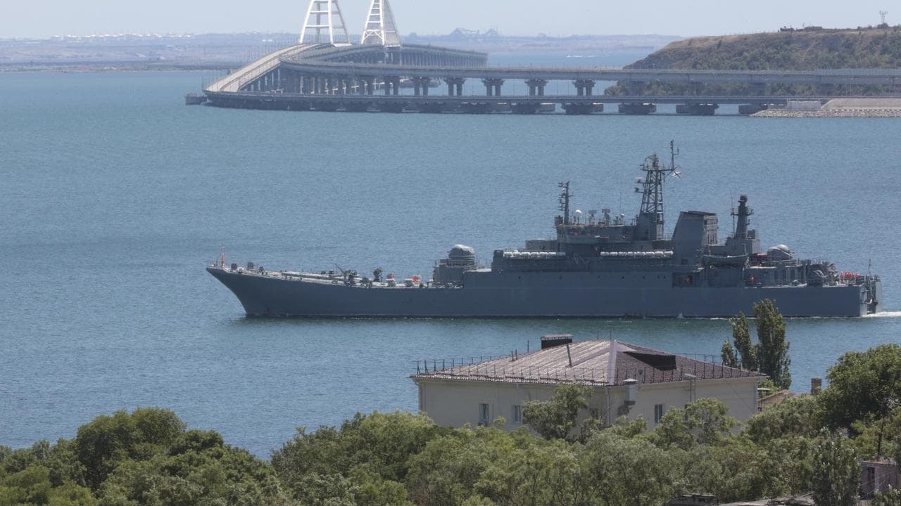 Russian warship fires warning shots at cargo ship