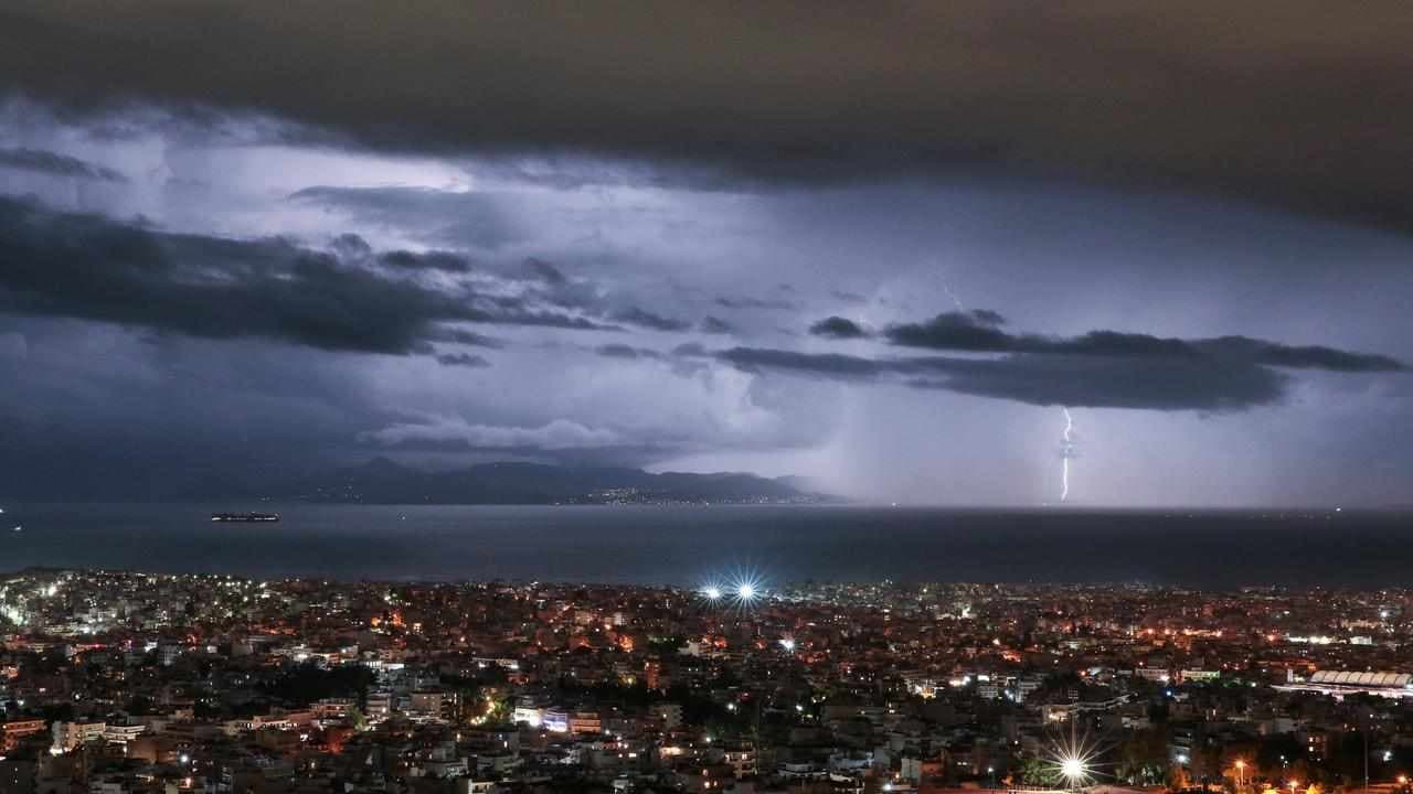 One dead as torrential rain follows wildfires in Greece