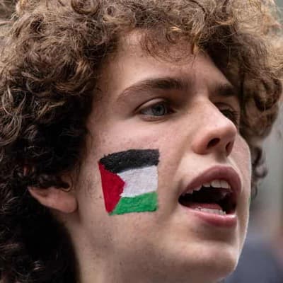 Pro-Palestine protesters rally at road cycling titles