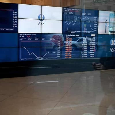 Aust shares edge lower on big day for earnings reports