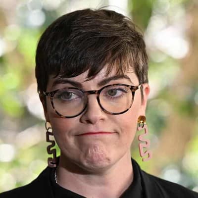 Woman to face court over crash that injured Qld MP