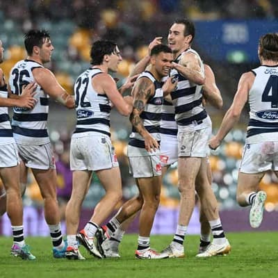 Cats clear on top as Lions cop lesson in the wet