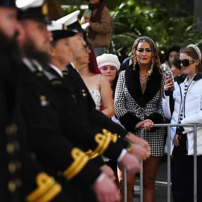 Solemn dawn before thousands march through Sydney