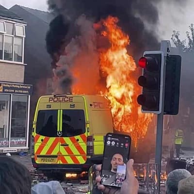UK police hurt in violent riot after three girls killed