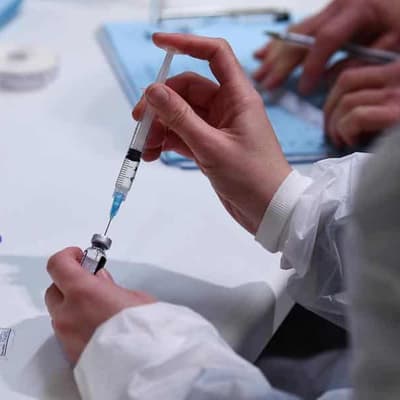 No, losing your human status is not a vaccine side effect