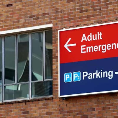 Man charged after being shot by police outside hospital