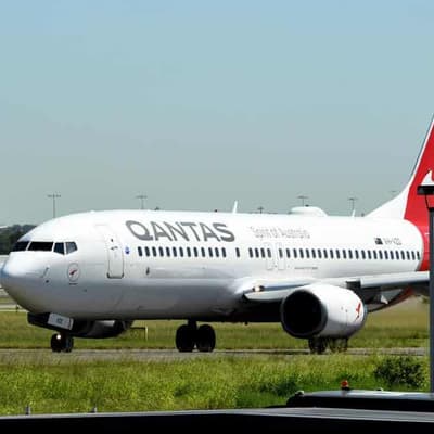 Qantas releases the loyalty parachute as profits fall