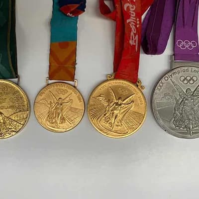 Man charged but no sign of missing Olympic medals