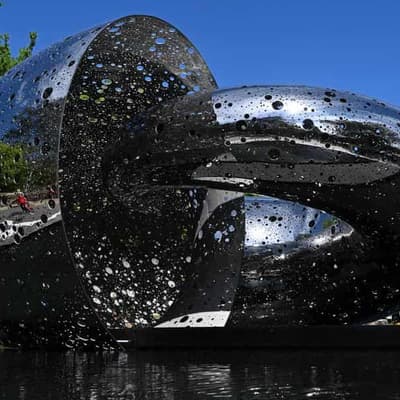 Holey moley! Massive Ouroboros sculpture eats limelight