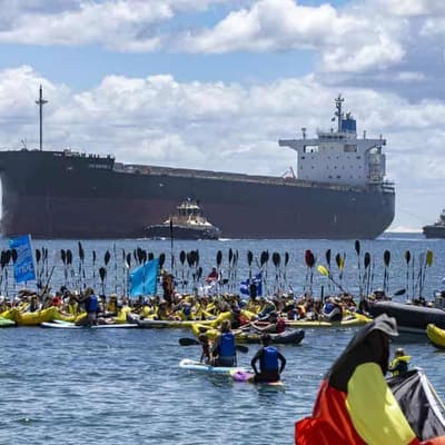 Protesters stop coal boats as more than 100 arrested