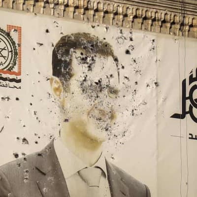 Syria rebels 'seize key city' in threat to Assad's rule