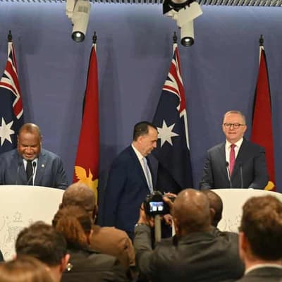 PM bets his 'life' NRL players will be safe in PNG
