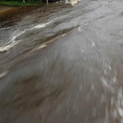 'They're gone': panic after men swept away by flood