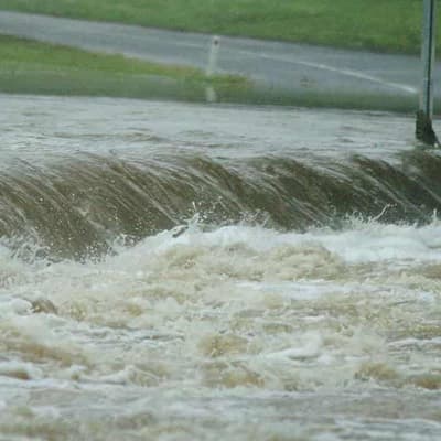 Man who drove into flood cleared of mates' manslaughter
