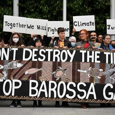 Santos cuts dividend, says Barossa project nearly done