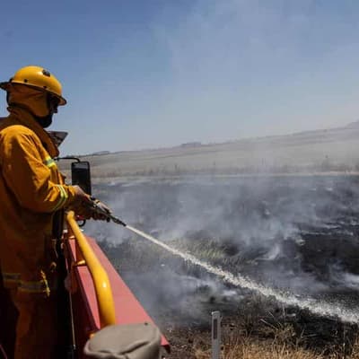 Warnings downgraded but out-of-control blazes continue