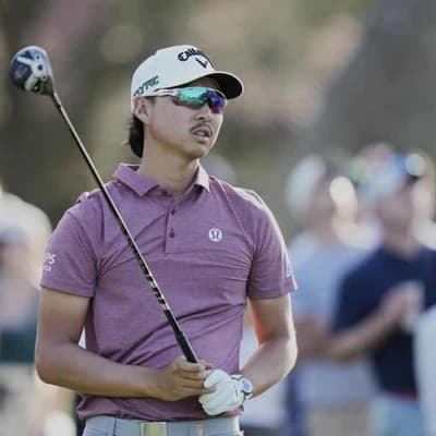 Lee tumbles as American grabs lead at windswept Players