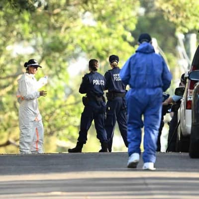 Murder charge after partially buried body uncovered