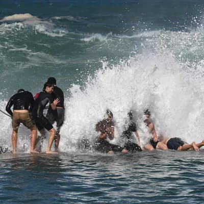 Famous beaches closed as monster swells lash coast