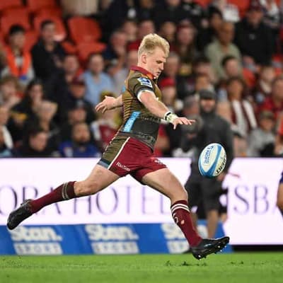 Lynagh at the double as Reds avoid a case of the Blues