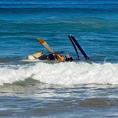 Three people rescued from seaside helicopter crash