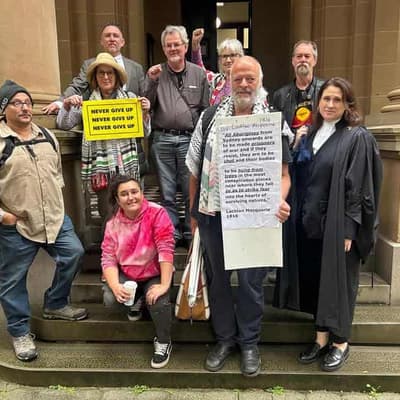 Massacre order poster on coloniser statue in court test