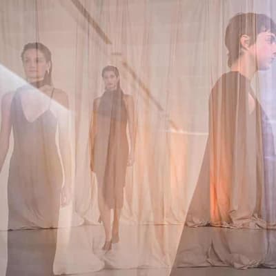 Designer brings beach to the runway in playful show