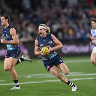 Smith shines as Cats survive Dogs' challenge in classic