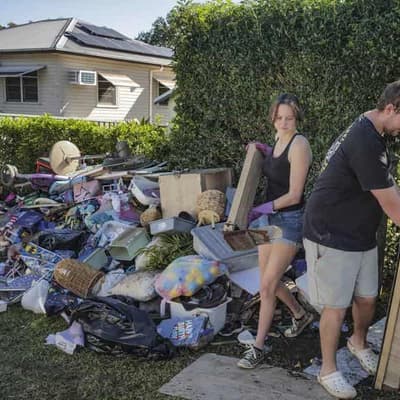 Flood-weary regions brace for high winds amid clean up