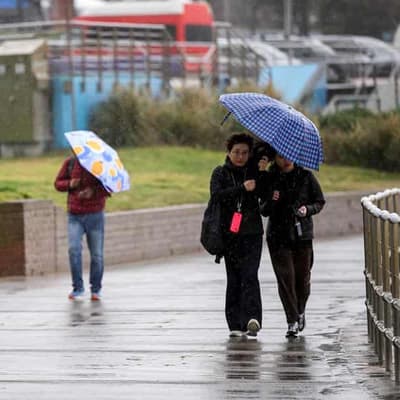 Major dam to likely spill as 'bomb cyclone' hits coast